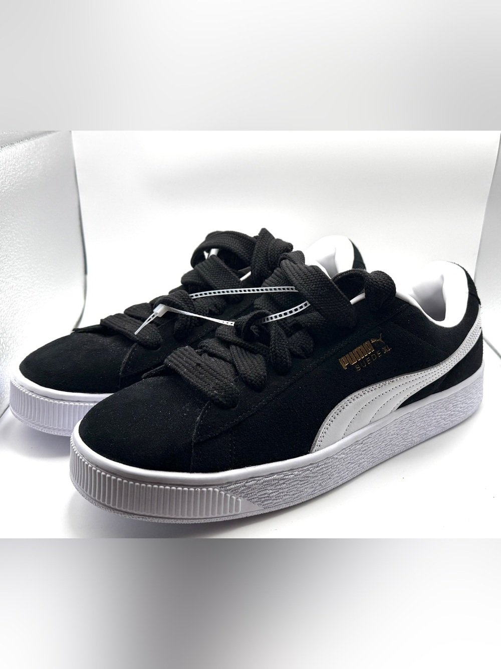 Puma Kids Suede Sneakers in Black and White with Gold Logo